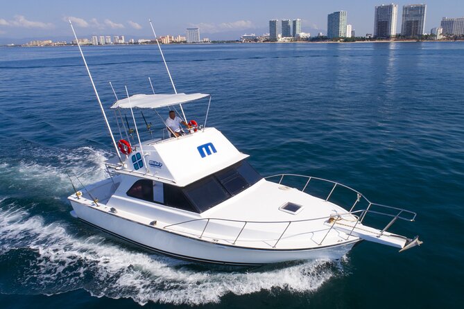 Bertram 38' Convertible Boat in Puerto & Nuevo Vallarta - Following Puerto Vallarta’s shoreline from the water