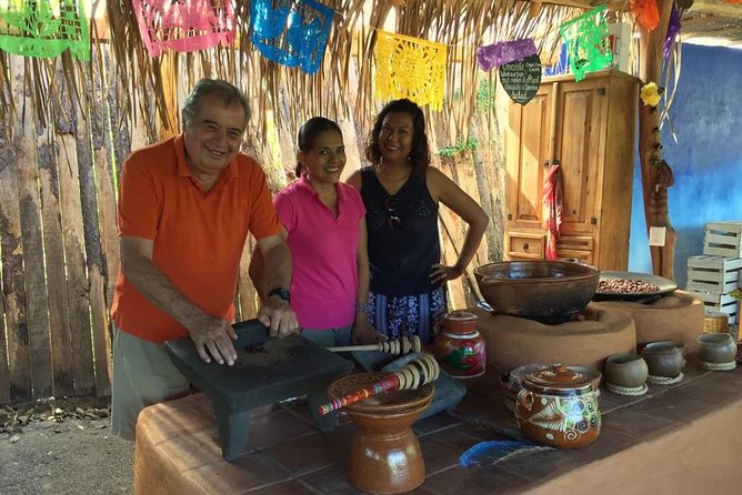 Chocolate Tour in Vallarta - Grinding cacao with a hand mill