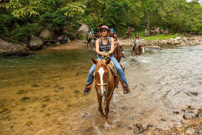 Combo Horseback Riding in Vallarta with ATV and Ziplines. - Horseback riding through rivers and tropical forest